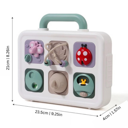 Close-up of a wooden busy board featuring various latches, gears, and textures, perfect for toddler sensory play.