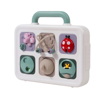 Portable toddler busy board with buckles, zippers, and a clock, designed for educational screen-free travel play.