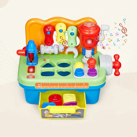 Toddler playing with an interactive musical workbench toy, developing fine motor skills