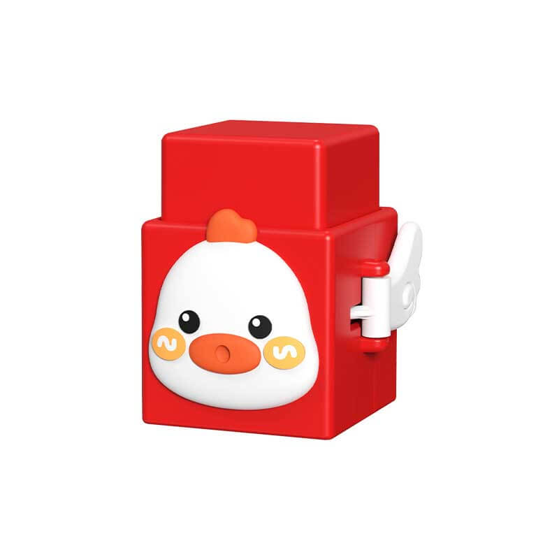 Close-up of a toddler's hand pressing down on an animal stacking toy, showing interactive play.
