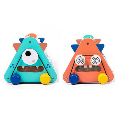 Preschool age child engaged with a multi-activity wooden learning games center.