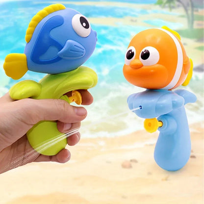 Toddler playing with colorful water toy set in a bath, splashing fun.