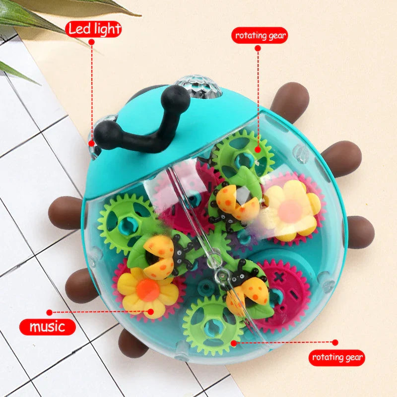 Toddler grasping the antennae of the Musical Beetle Toy, a perfect baby activity toy and gift.