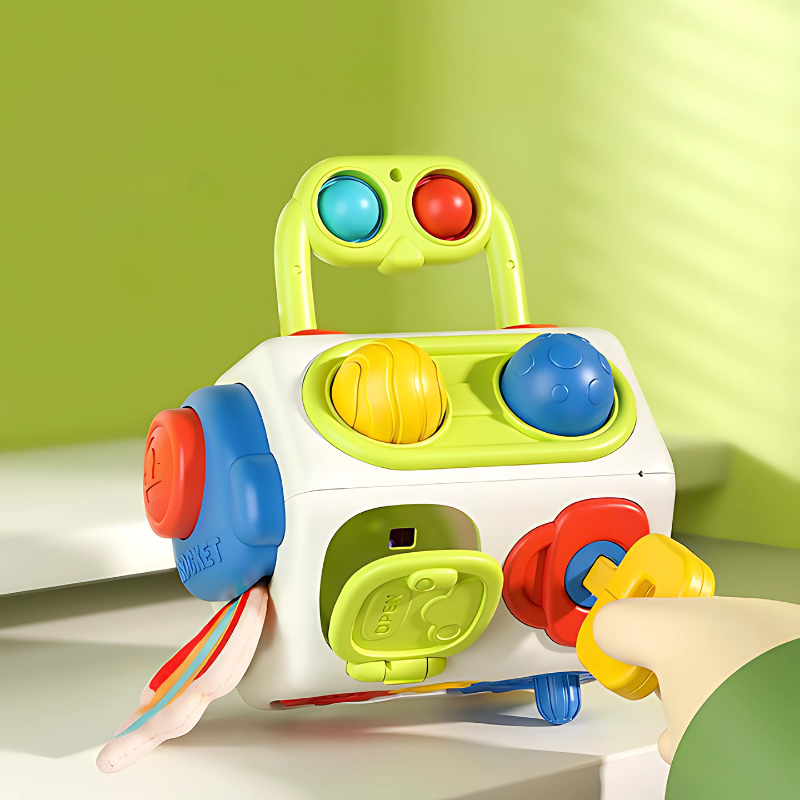 Toddler playing with Interactive Sensory Activity Cube, developing fine motor skills