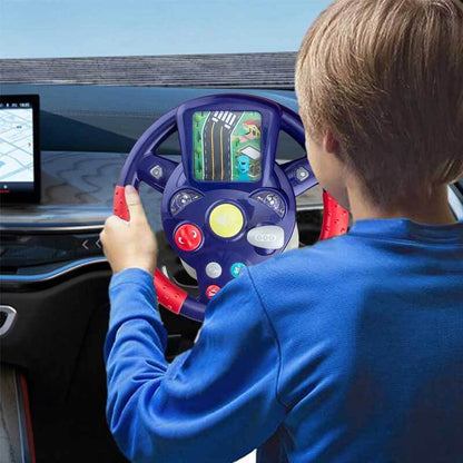Close-up of a child's hands gripping an interactive steering wheel toy with colorful buttons.