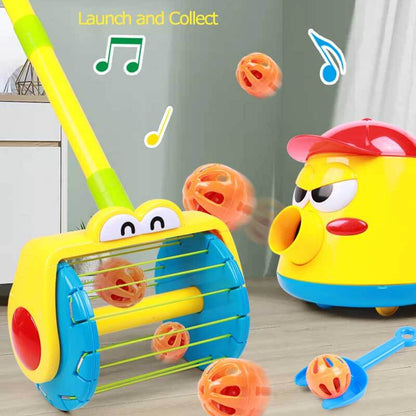 Close-up of a child's hand launching a colorful bell ball with an activity toy