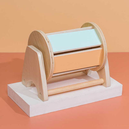 Toddler happily exploring a wooden Montessori educational activity box with various latches