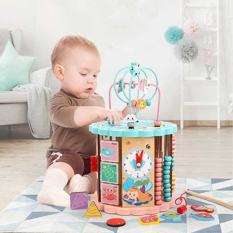 Toddler playing with wooden learning toy center, engaging and educational, for preschool development