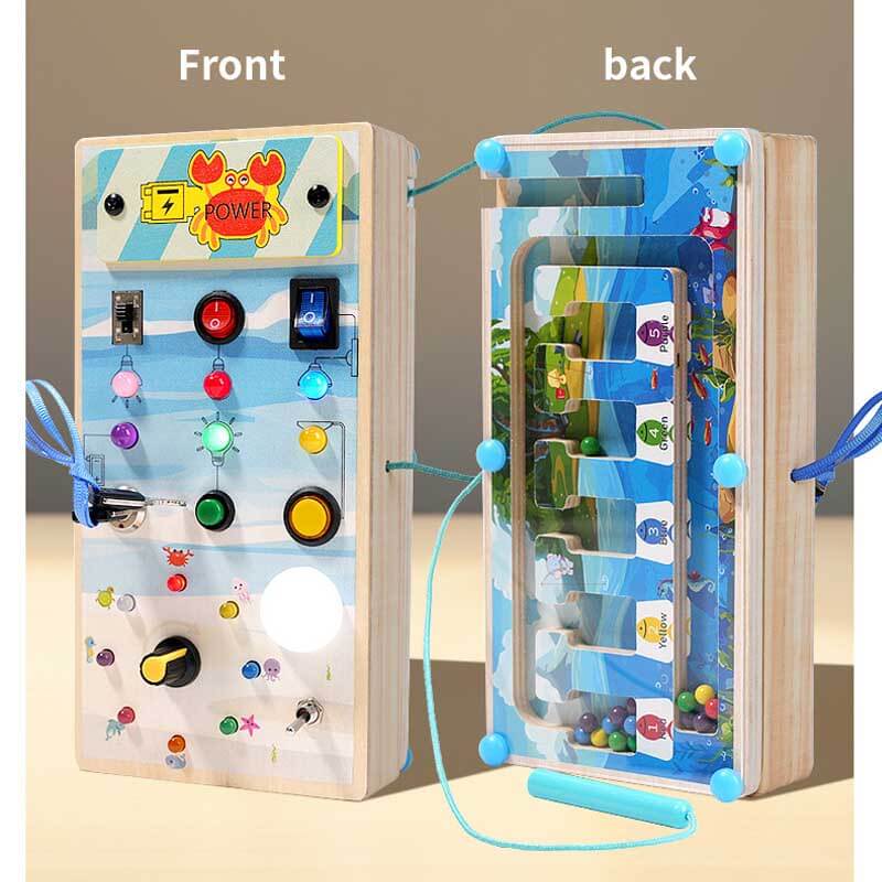 Child's hands exploring a wooden sensory switch board, developing fine motor skills