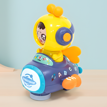 Toddler plays with a yellow and black buzzing bee learning toy, enhancing motor skills and sensory development.