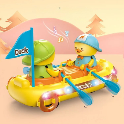 Toddler pulling a yellow Discover Play Duck Pull-Along Toy with red wheels for outdoor motor skills development