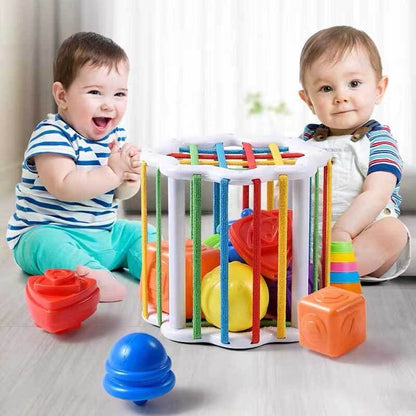 Sensory shape sorter with rainbow blocks, designed to boost toddler fine motor skills and learning.