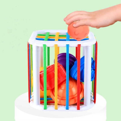 Top view of a toddler rainbow shape sorter, showing vibrant colors and different shapes.