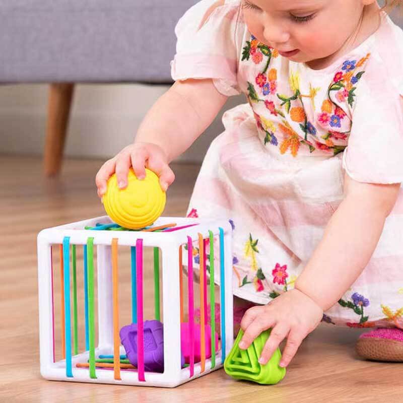 Educational rainbow toy set for babies, includes sensory blocks and a shape sorter.
