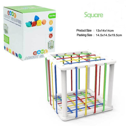 Toddler engaged in sensory play with a rainbow shape sorter. Early development learning game.