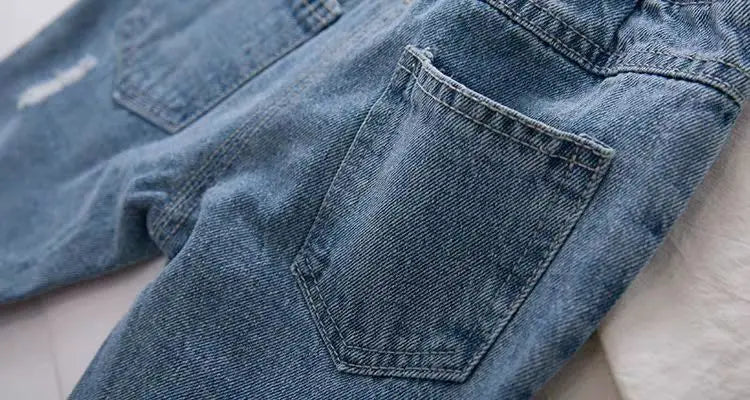 Elastic waist ripped denim jeans, offering comfort & style for young children