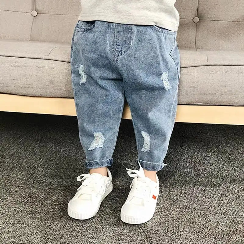 Back view of toddler ripped jeans, showing pockets & elastic waist, children's fashion