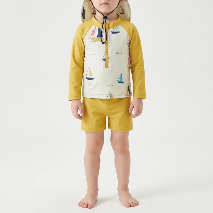 Kids' long-sleeve sun protection swim top, matching shorts, and hat. Perfect baby swim outfit for summer fun & safety.