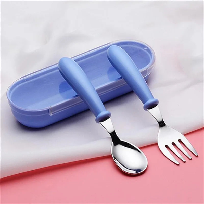 Packaged toddler's cartoon stainless steel dinnerware set, ready for gifting. Child-safe kids tableware.