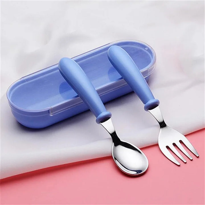 Packaged toddler's cartoon stainless steel dinnerware set, ready for gifting. Child-safe kids tableware.