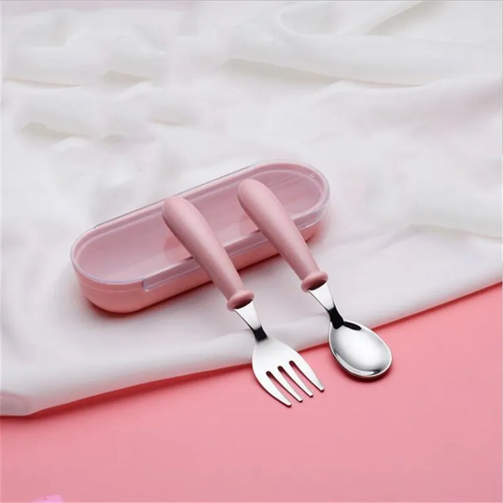 Durable pink toddler dinnerware set, crafted from stainless steel with cute cartoon designs for lasting use.