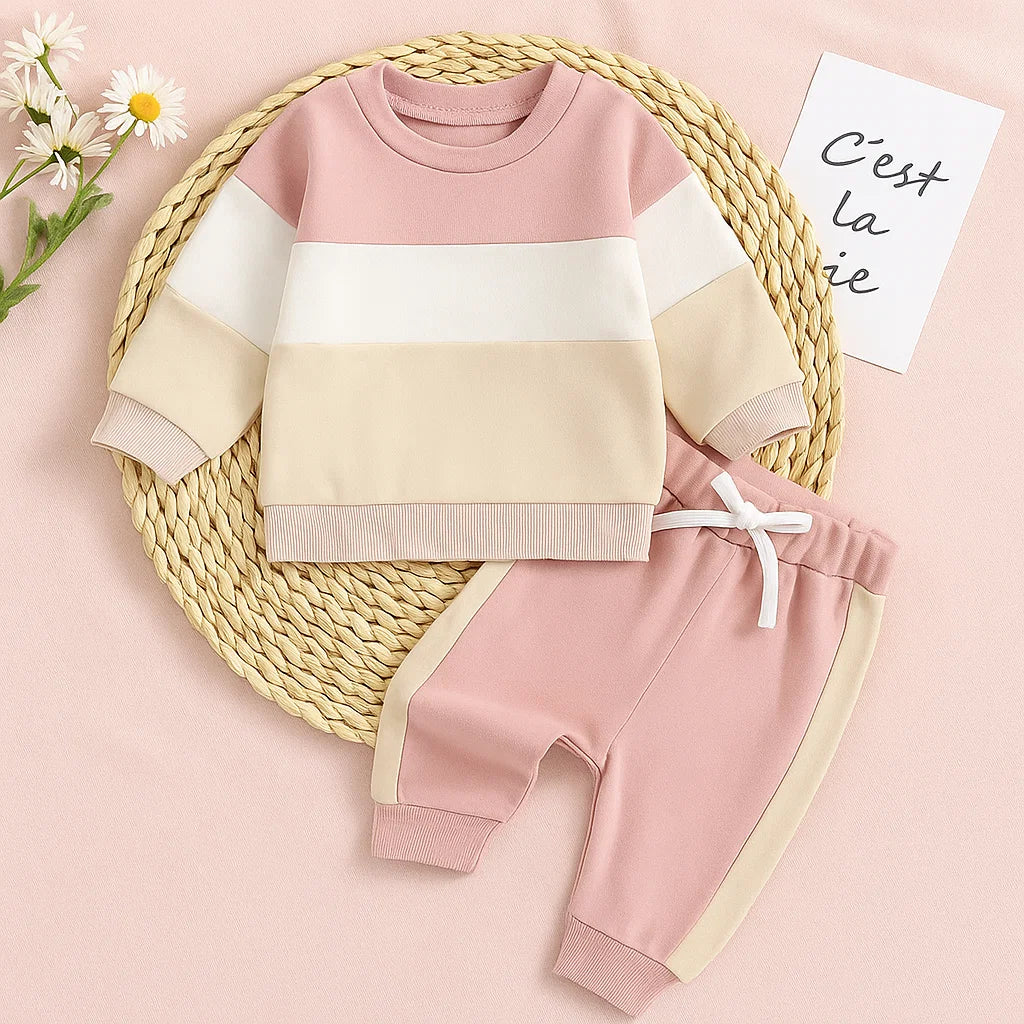 Toddler wearing a comfortable, unisex knitwear sweatshirt and jogger set, perfect for play.