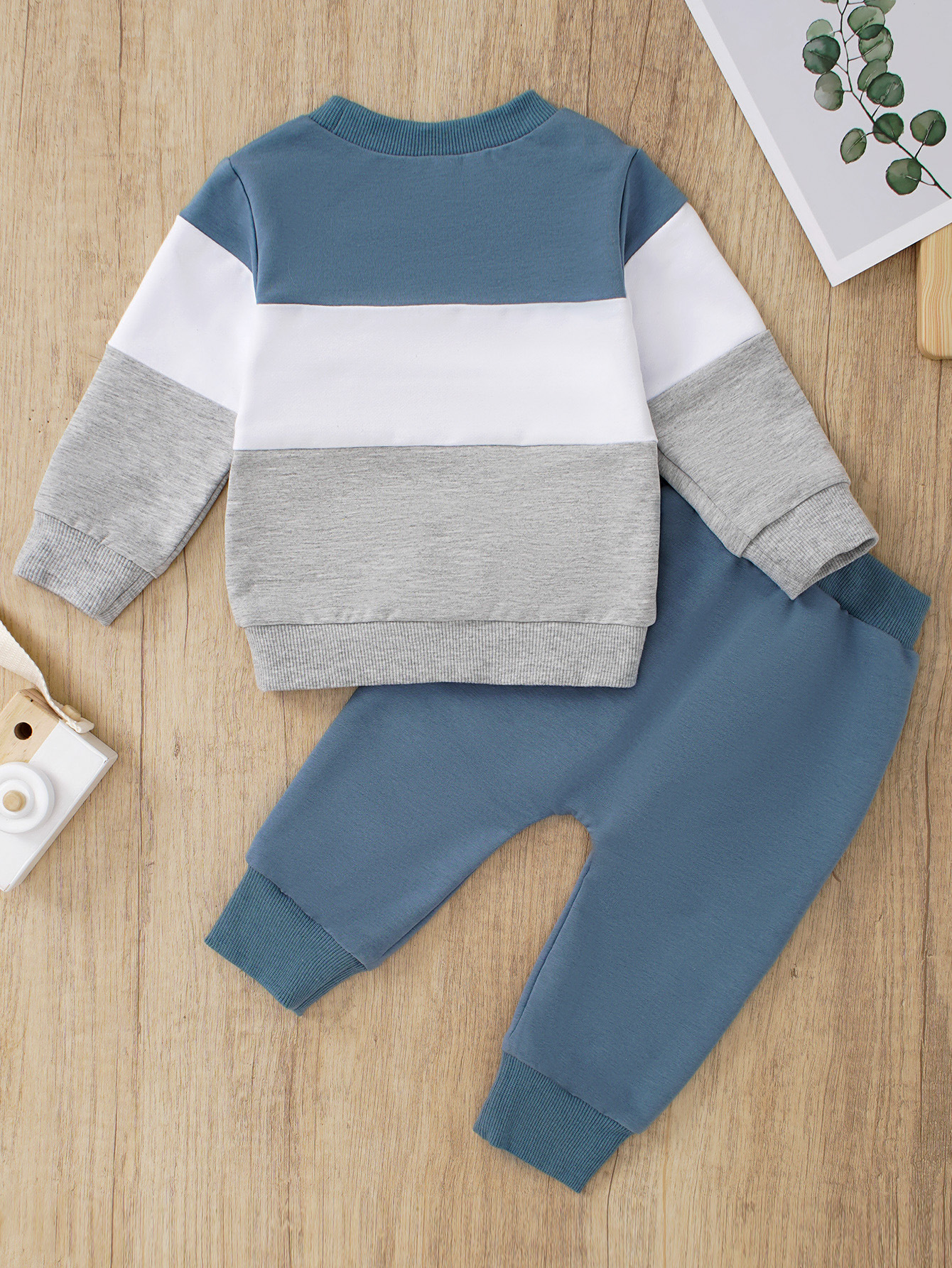 Complete toddler set: cozy knit sweatshirt and matching joggers, essential children's clothing.