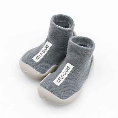 Baby accessories: Green soft-sole sock shoes made from breathable cotton blend fabric