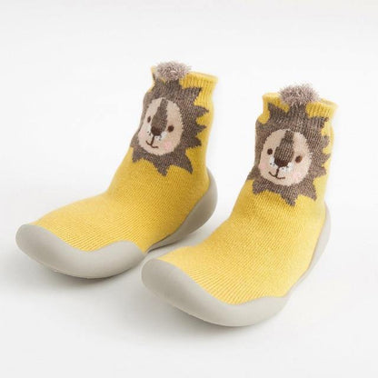 Zoomed-in look at the elastic cuff of a soft-sole sock shoe, ensuring a snug fit for infants