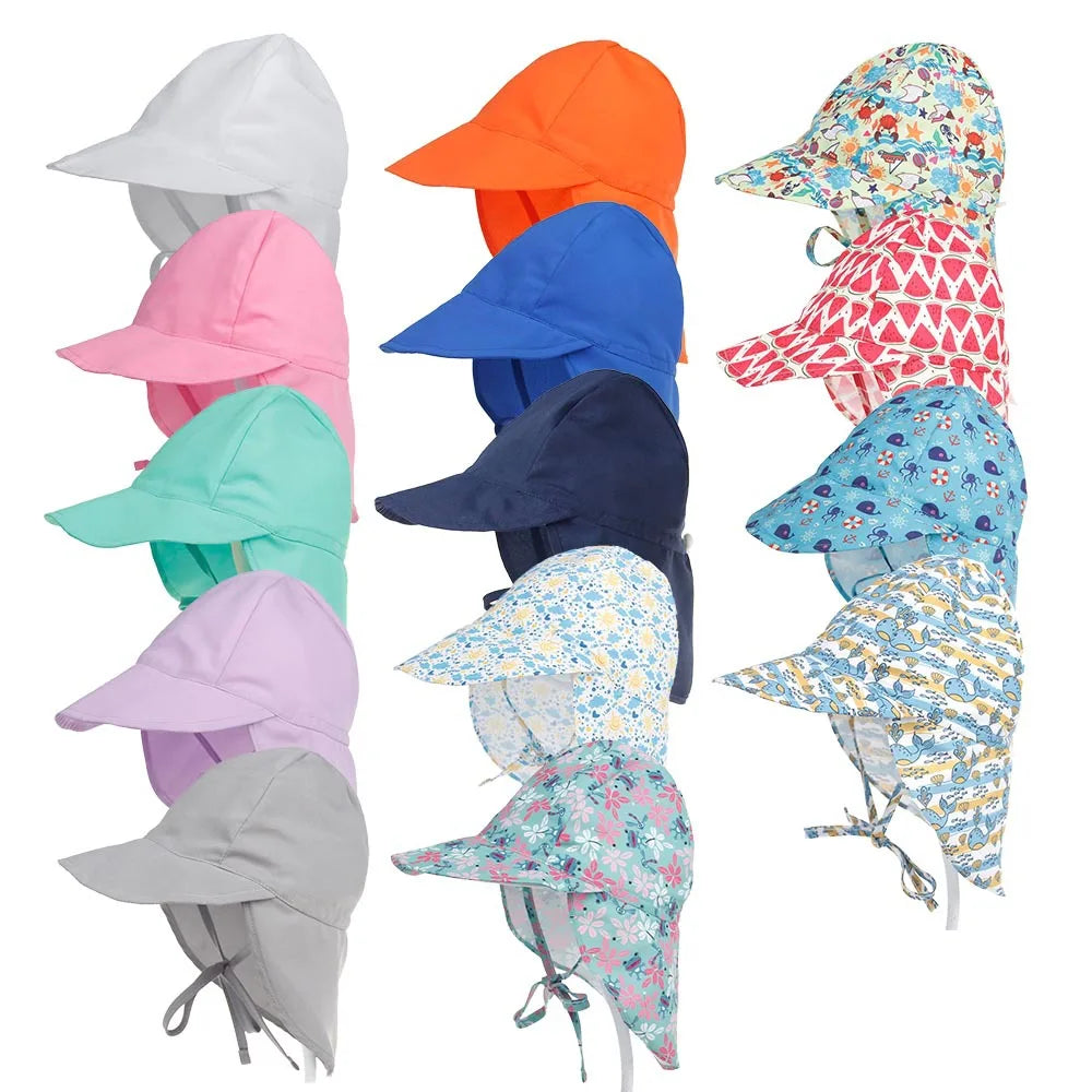 Kids' blue quick-dry UV bucket hat on a sandy beach, ready for summer fun