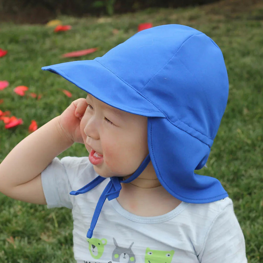 Kids' blue polyester bucket hat with UV protection and quick-dry fabric for beach days