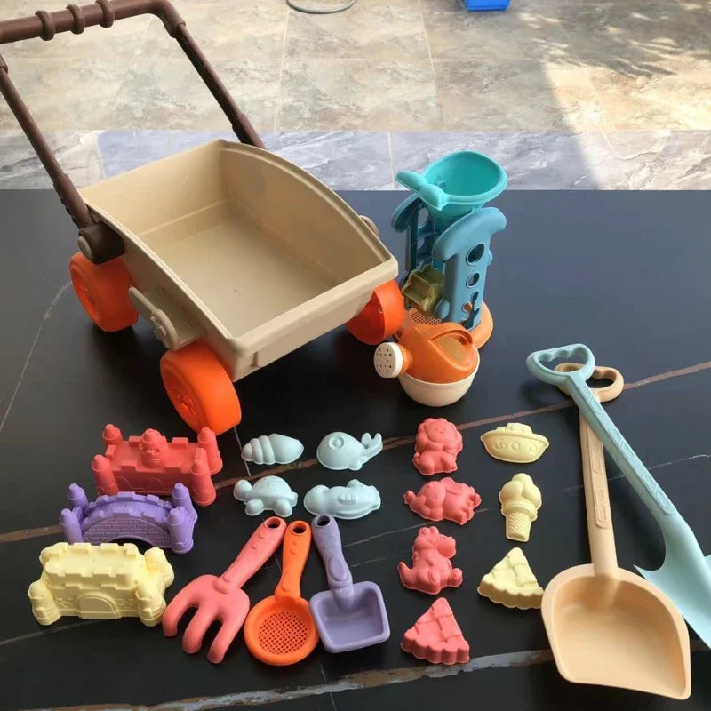 Summer fun beach cart toy set for toddlers, including sand molds, rake, and shovel for engaging play