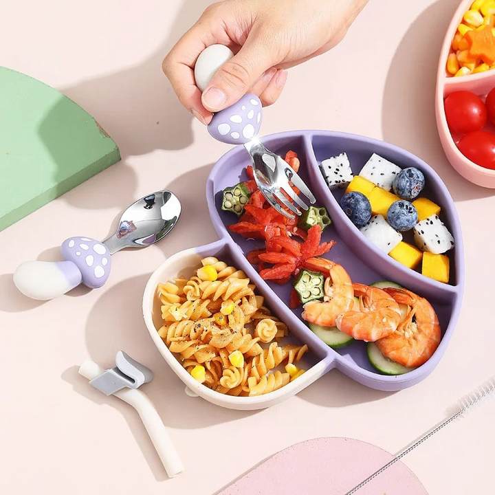 Toddler self-feeding silicone suction plate in green, non-slip base for easy mealtime for kids