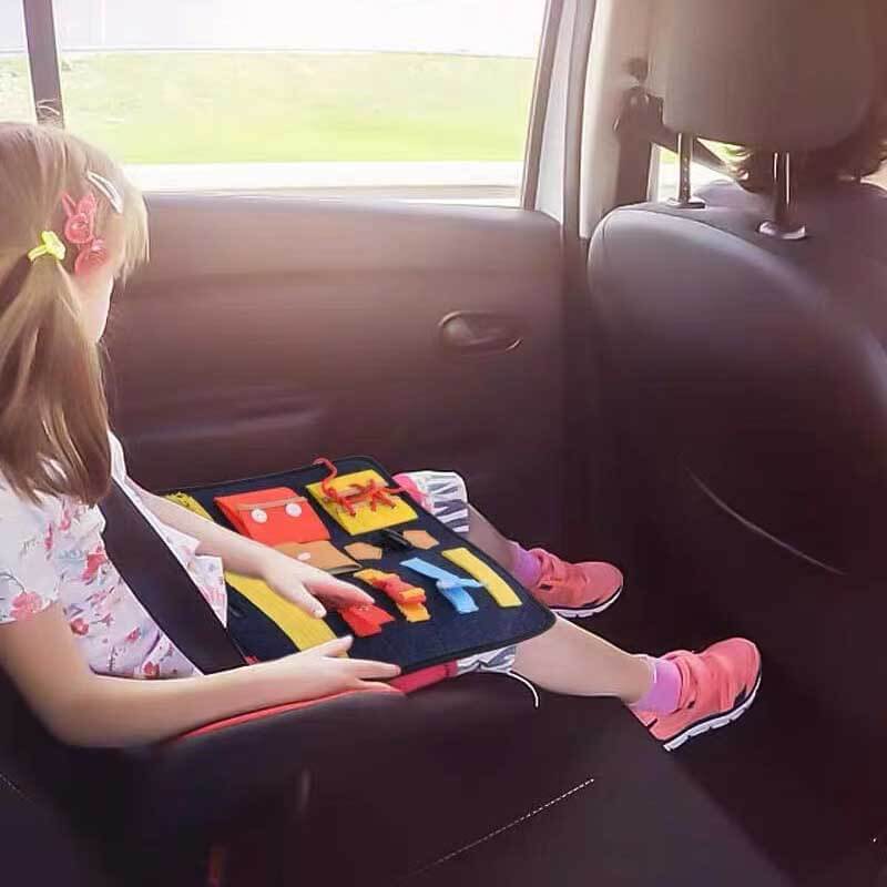 Wooden and fabric busy board, designed as a Montessori toy for early childhood education.