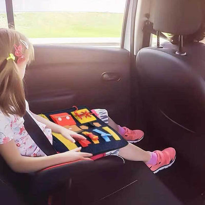 Wooden and fabric busy board, designed as a Montessori toy for early childhood education.
