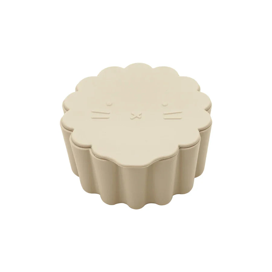 Interior view of a silicone snack cup, showing easy-to-clean soft flaps for baby feeding