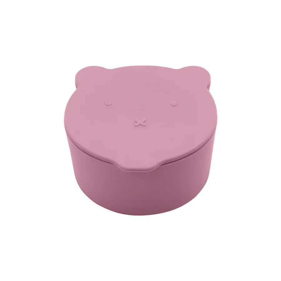 Hand holding a light blue silicone snack cup with a cute cartoon whale lid, kids food container
