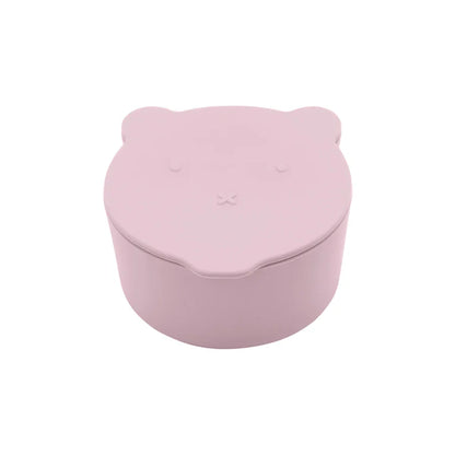Orange silicone spill-proof snack cup with a friendly cartoon dinosaur lid for toddlers