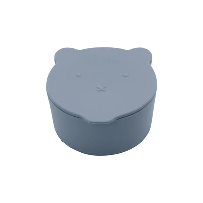 Close-up of the textured grip on a silicone spill-proof snack cup, easy for small hands