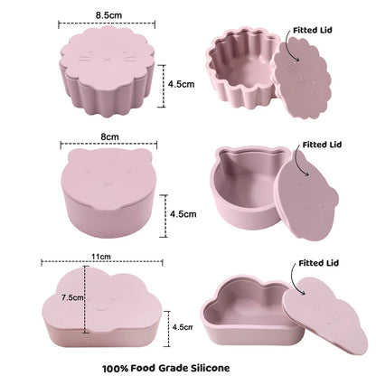 Soft pink silicone snack cup with cartoon bear lid, perfect for spill-proof toddler feeding