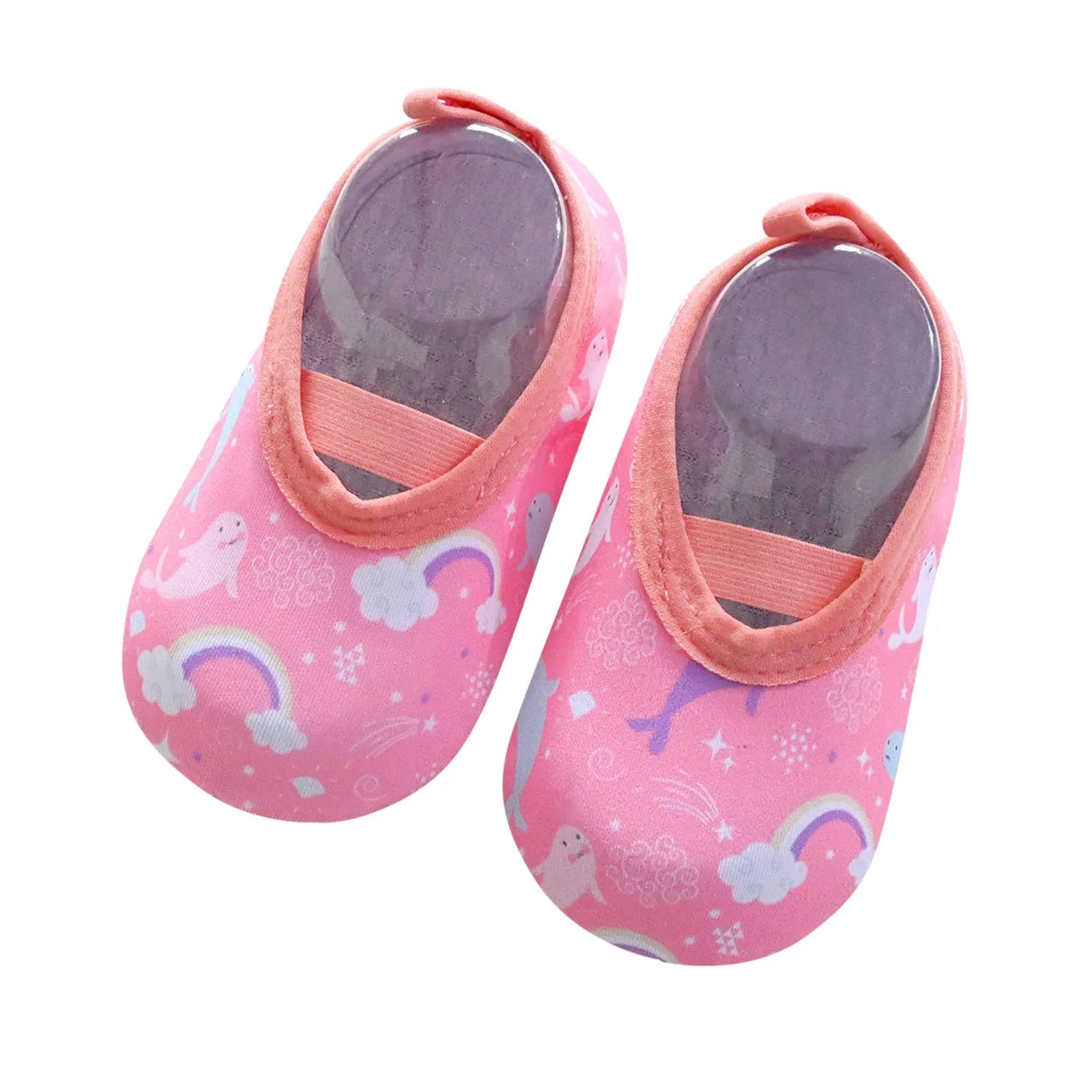 Happy toddler splashing water in yellow slip-on beach shoes, essential summer footwear for kids