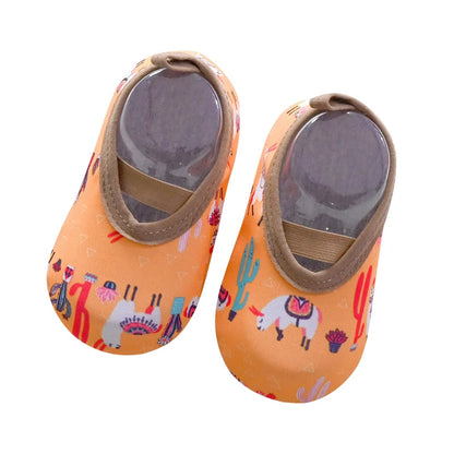 Blue kids' slip-on water shoes drying in the sun, quick-drying material for beach and swim wear