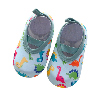 Close-up of kids' pink slip-on water shoes with elastic opening, ideal for beach and swimming