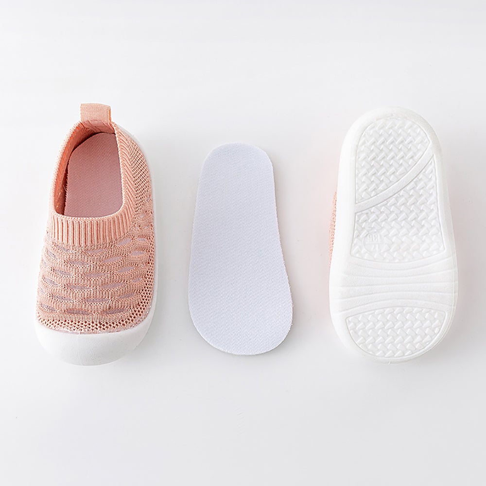 Pair of pink baby slip-on shoes with anti-slip sole, designed for easy wear and child development.
