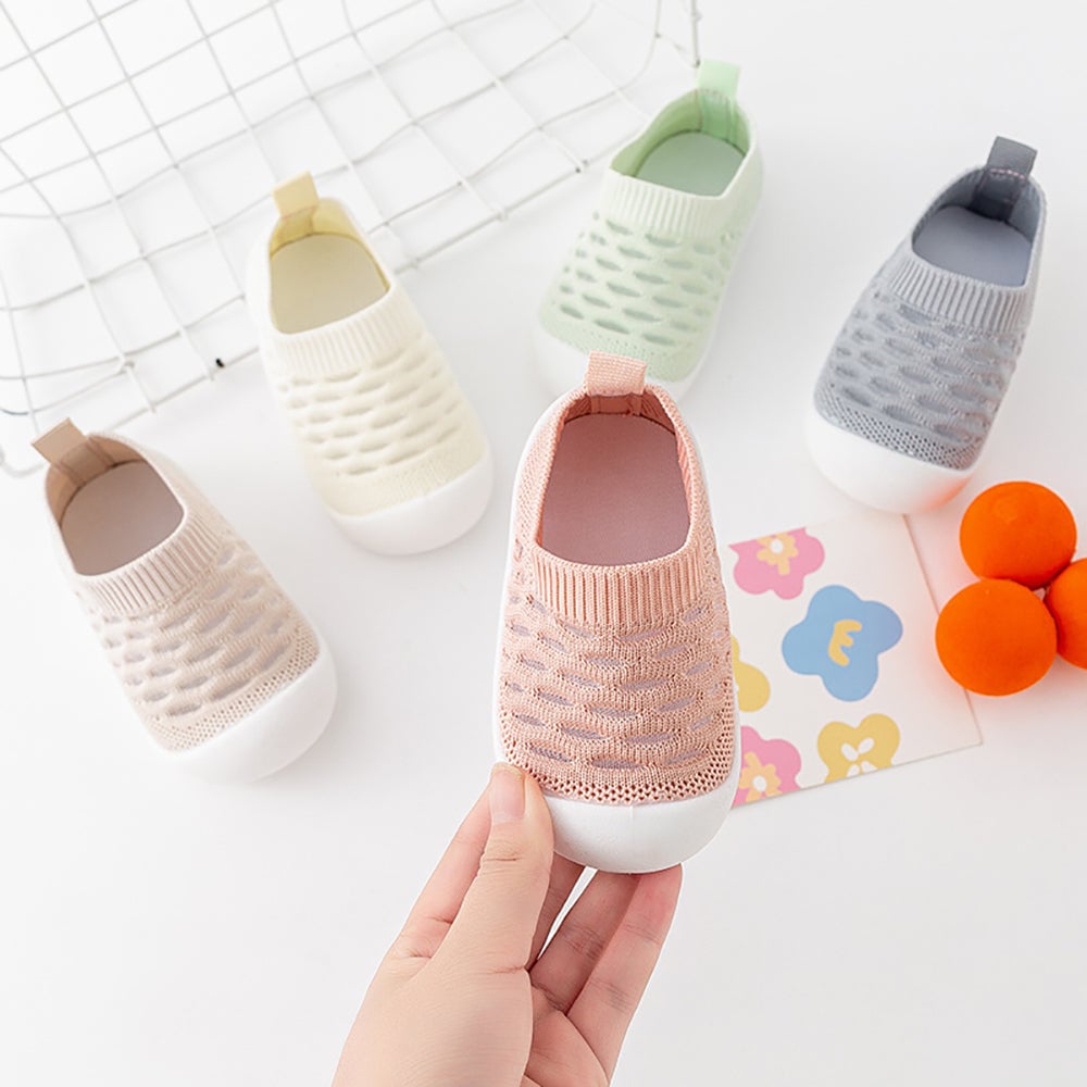 Close-up of grey kids footwear, breathable polyester fabric, ideal for active toddlers.