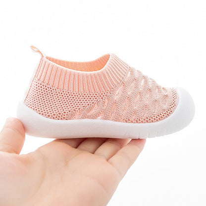 Side view of infant slip-on shoes, lightweight and flexible for early walkers.