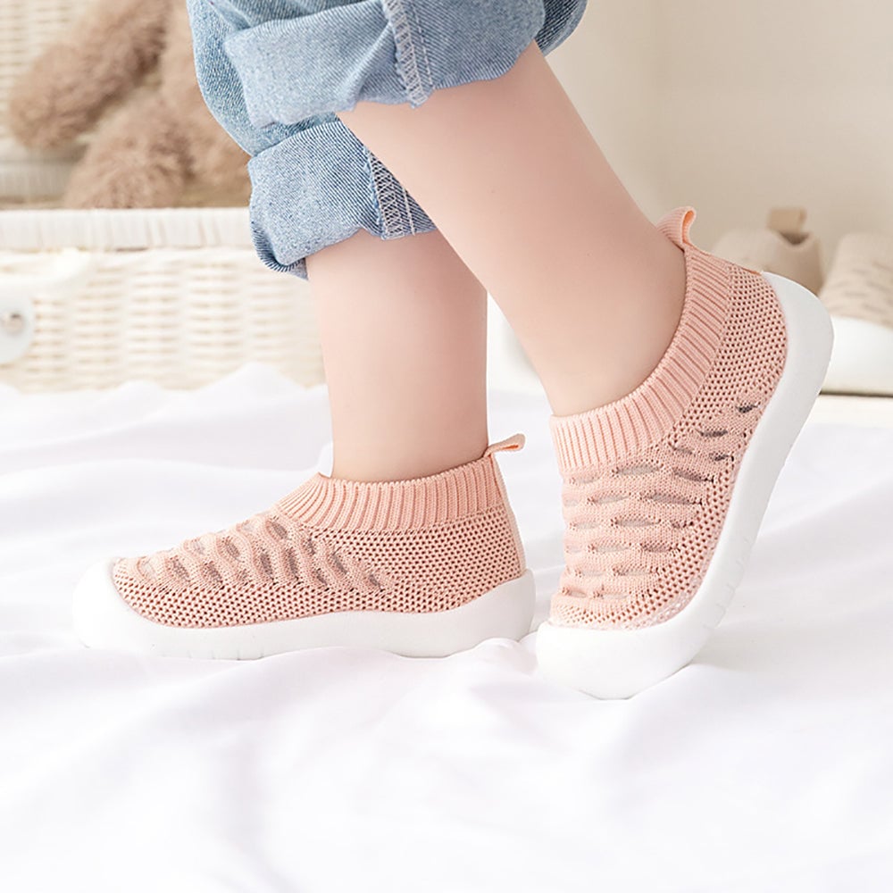 Children's comfortable slip-on shoes in a vibrant red, easy wear design for active play.