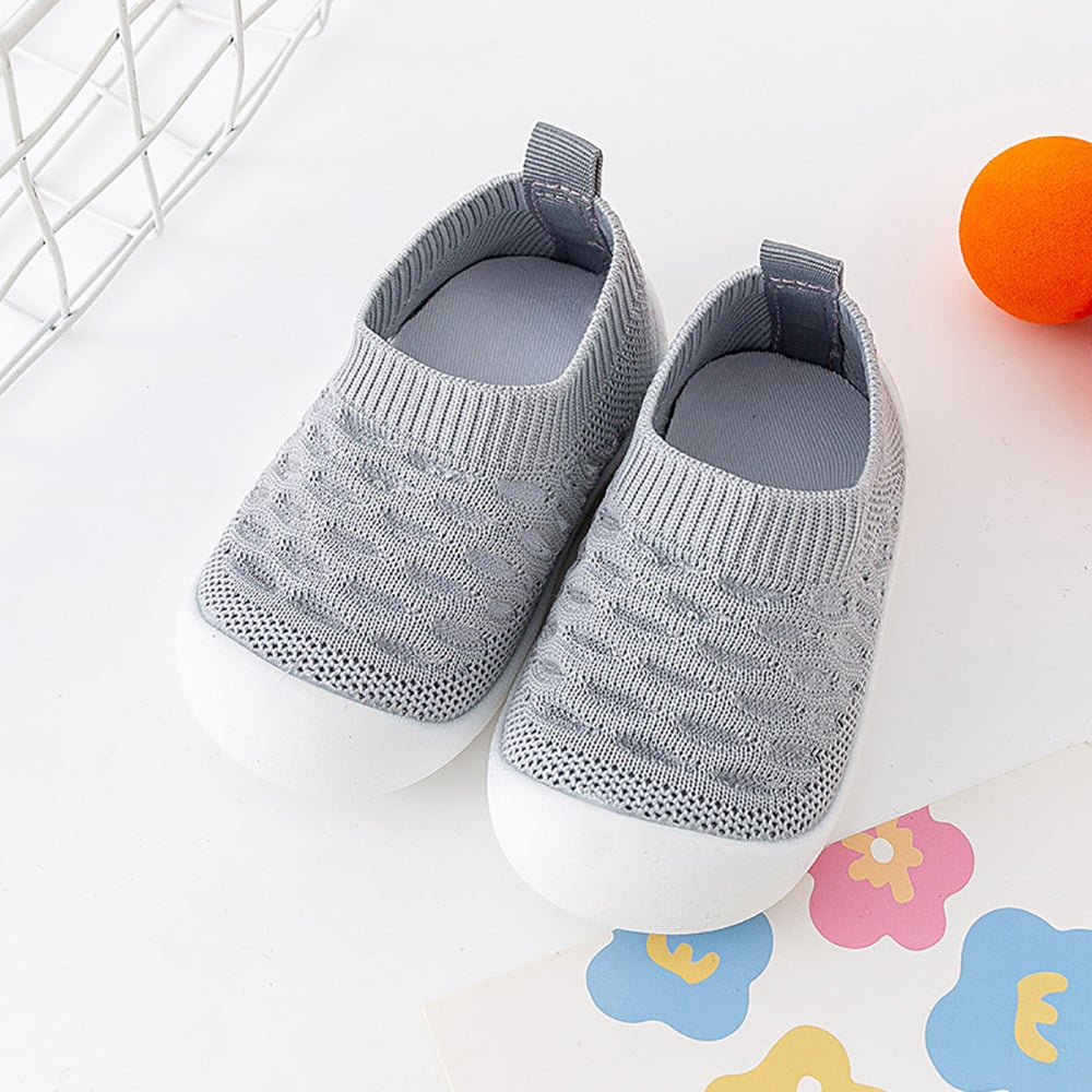 Anti-slip baby shoes with a soft sole, ensuring safety and comfort for infants.