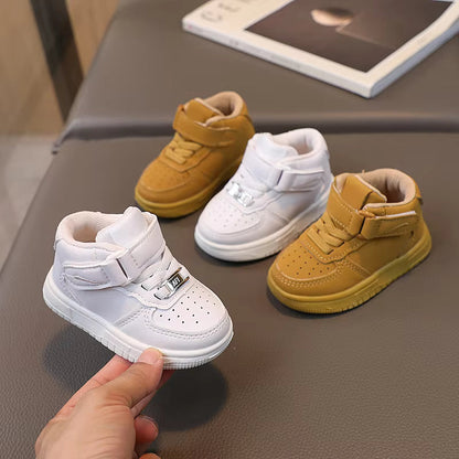 Pair of yellow toddler sneakers with strong velcro straps, ideal for growing kids' shoes