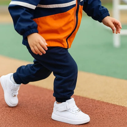 Toddler's sturdy velcro sneakers in a vibrant orange, built for comfortable and lasting wear